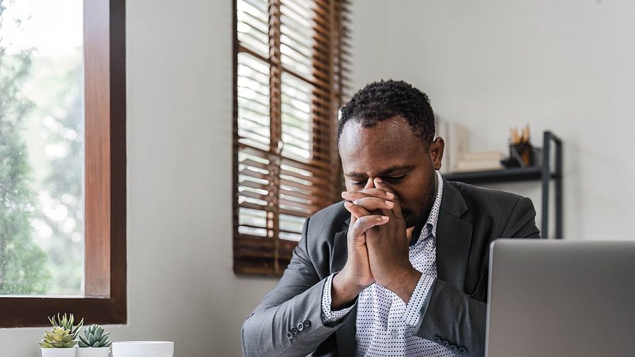 Stressed man on laptop can't find a job