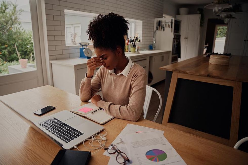 Stressed woman on laptop