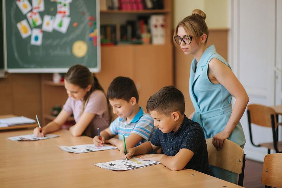 Students complete a worksheet during class