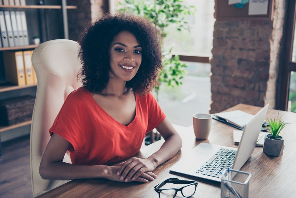 Successful businesswoman is happy working her dream job every day.