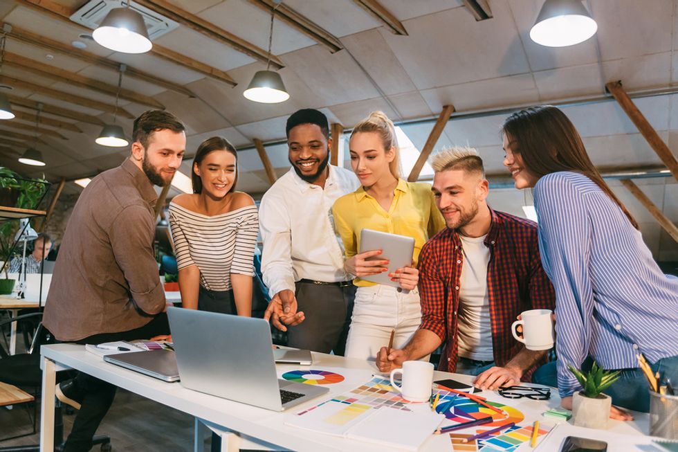 Successful team has fun during a work meeting