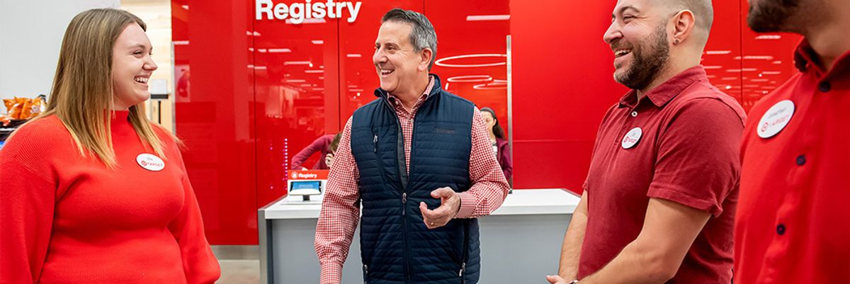 Target CEO Brian Cornell speaks with employees at a Target store.