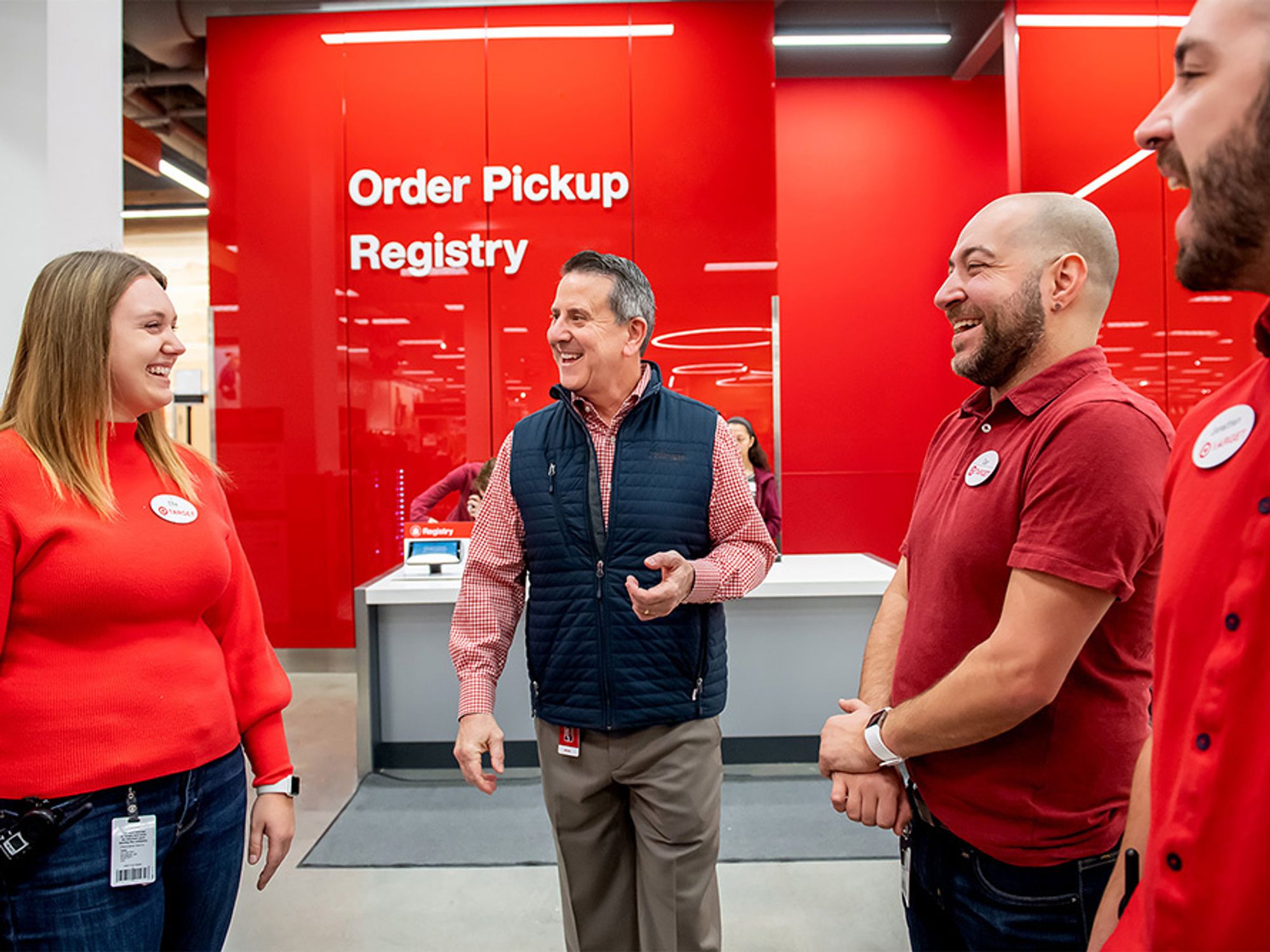 Target CEO Brian Cornell speaks with employees at a Target store.