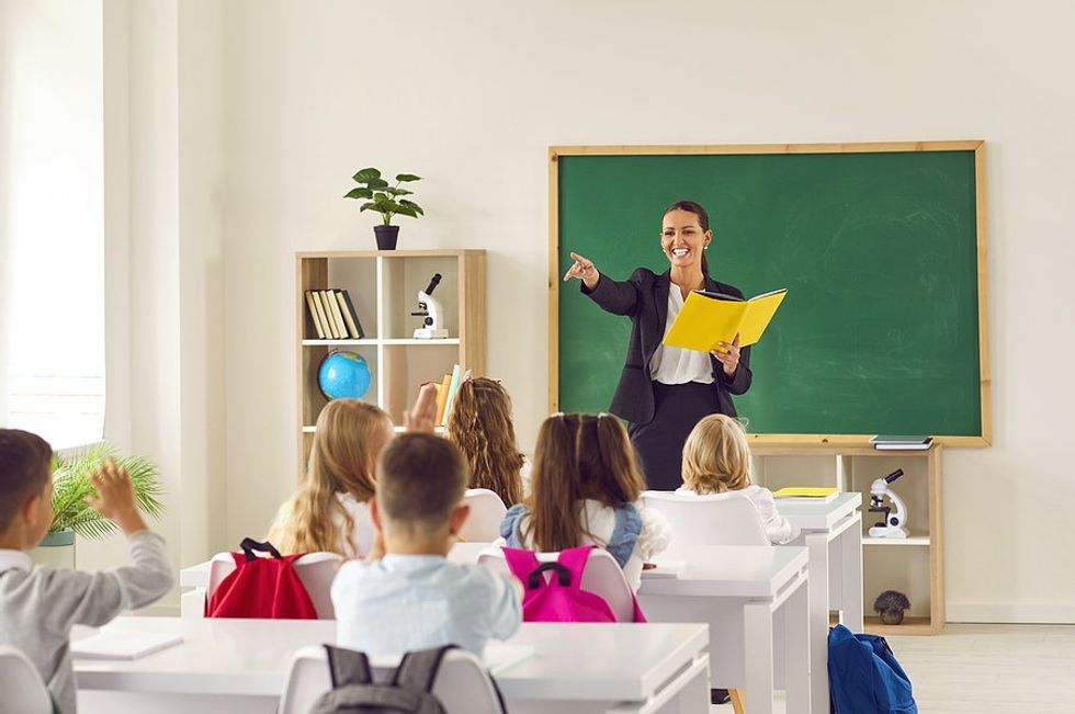 Teacher calls on a student in her classroom