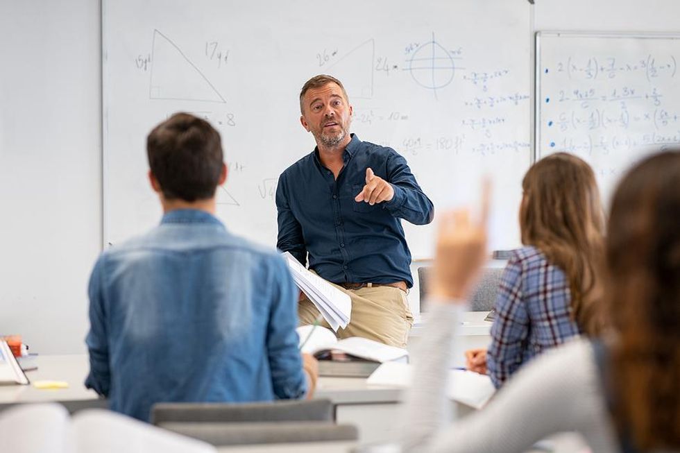 Teacher calls on a student in the classroom