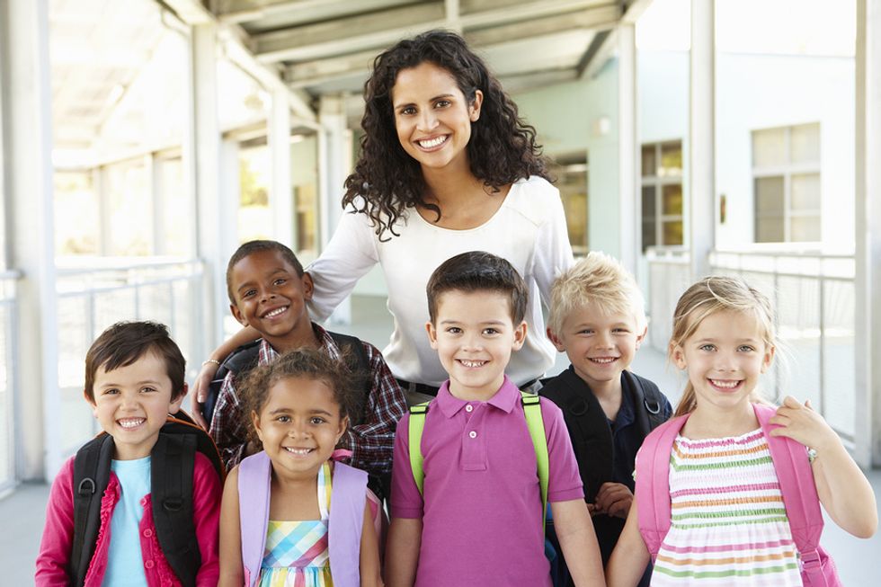 Teacher with her happy students