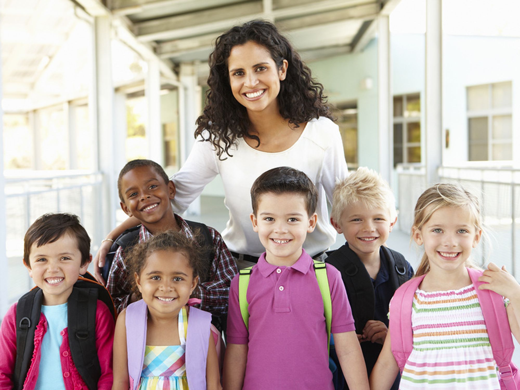 Teacher works with students during the summer