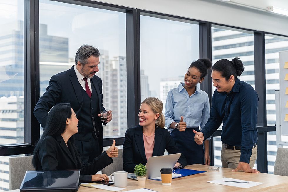 Team members motivate each other at work