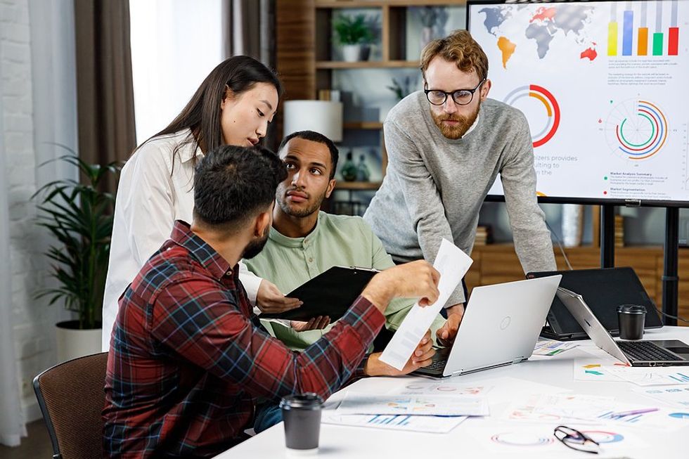 Team members talk during a work meeting