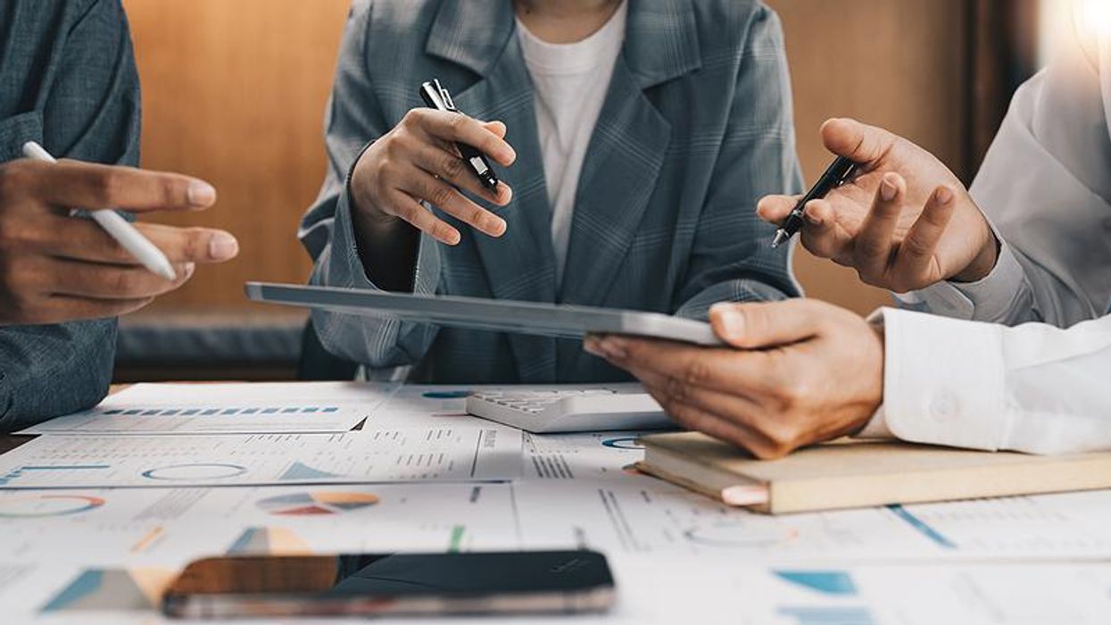 Team sets goals and creates a business plan during a meeting