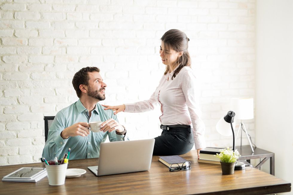 Two colleagues have a romantic fling at work