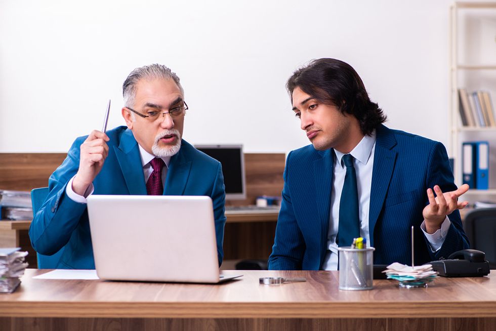 Two coworkers discuss a customer concern.