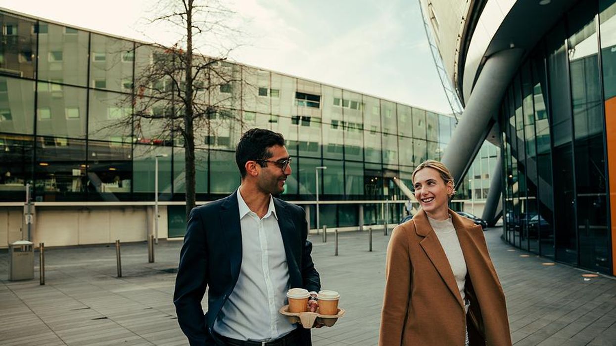 Two coworkers go for a walk at work
