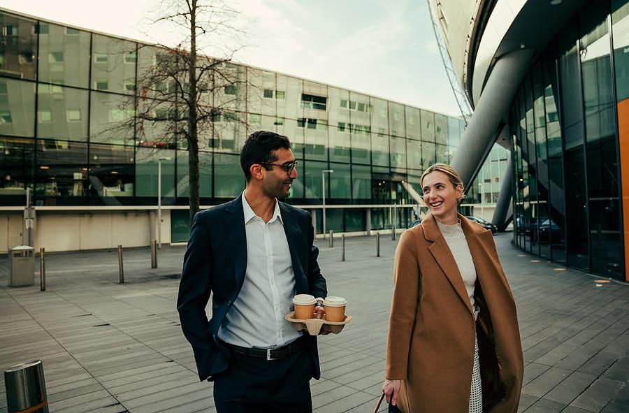 Two coworkers go for a walk at work