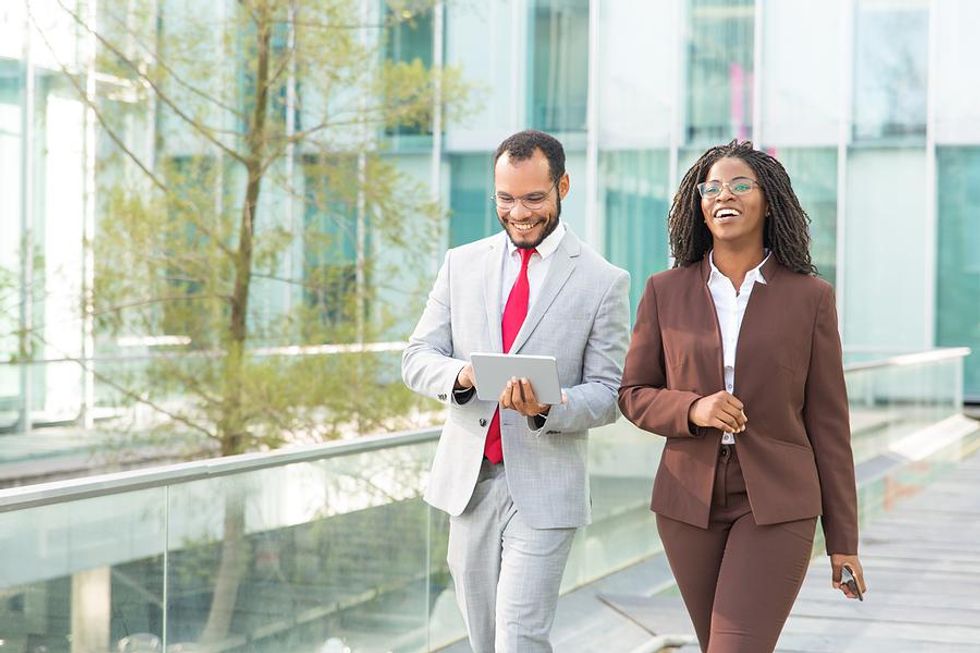 Two coworkers go for a walk on their break