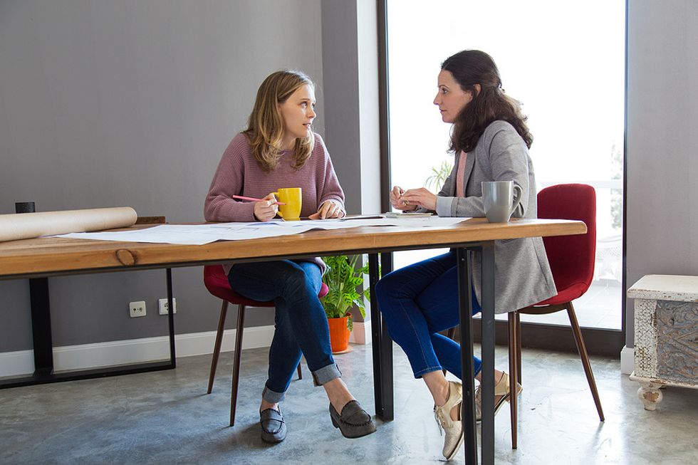 Two coworkers talk about failures in their industry