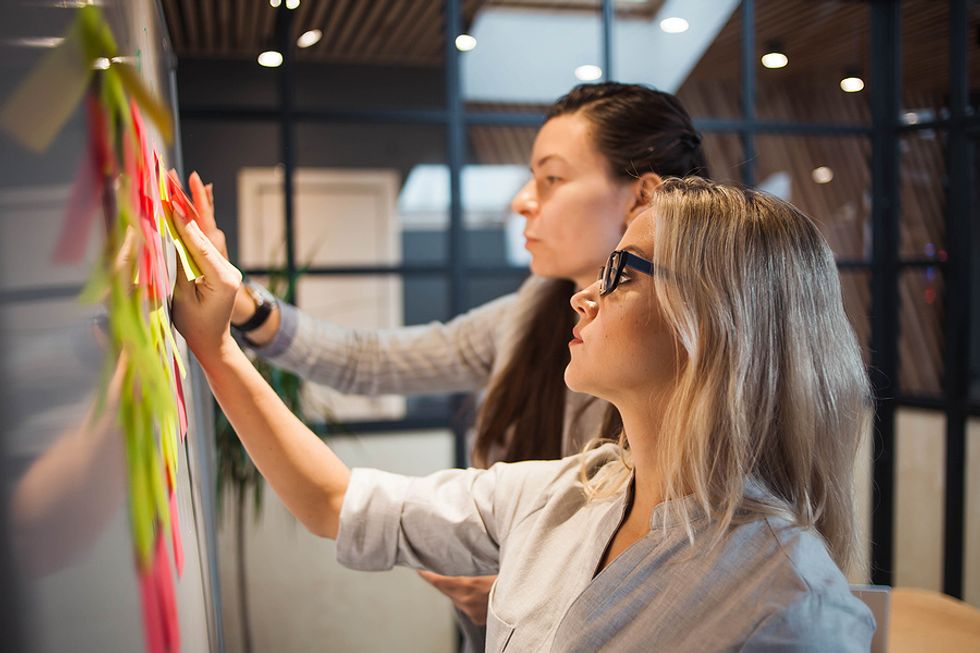 Two female executives figuring out a new business strategy