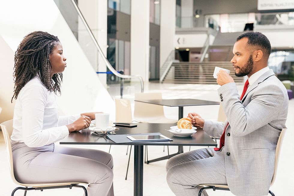 Two former coworkers meet to discuss the job search process.