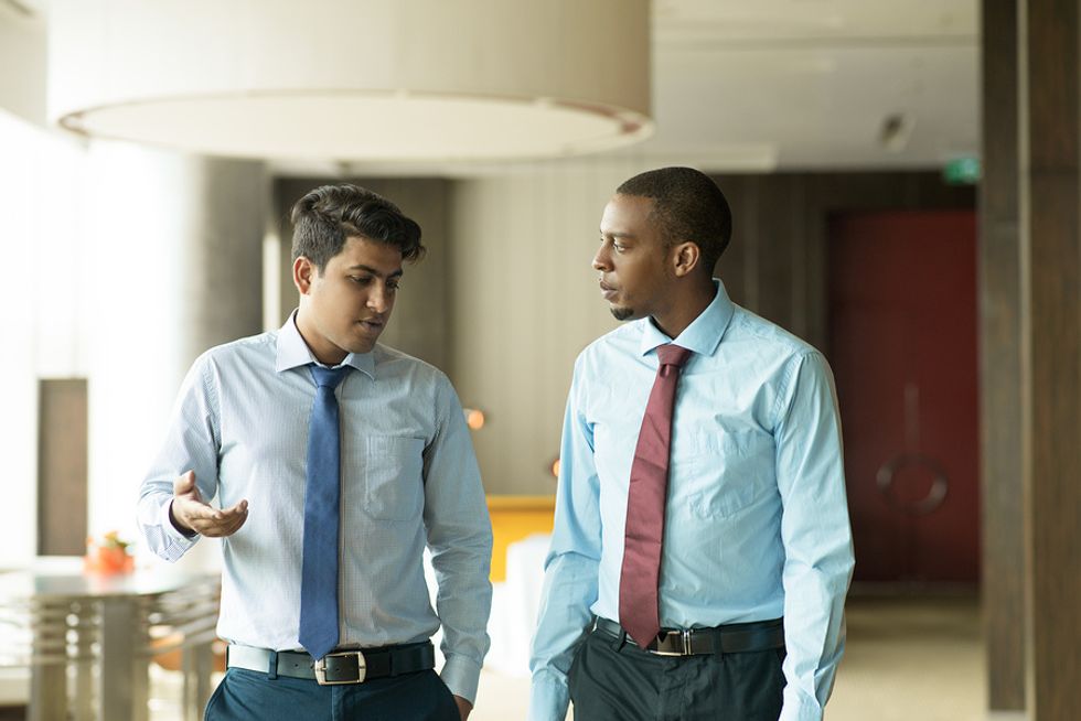 Two male co-workers talking about why they don't get along at work and trying to find a solution.