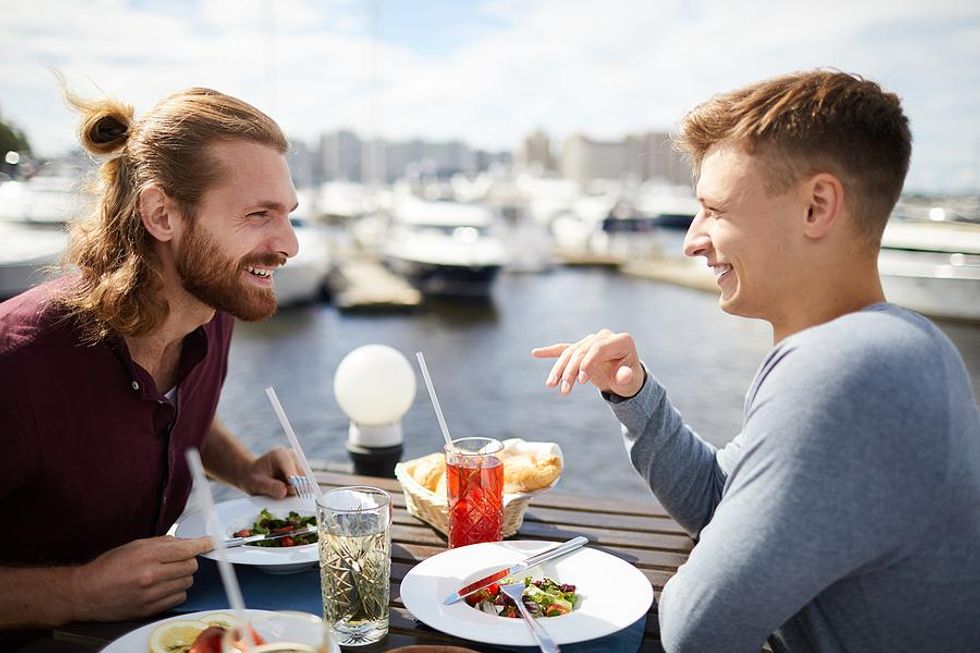 Two men on a date talking about work