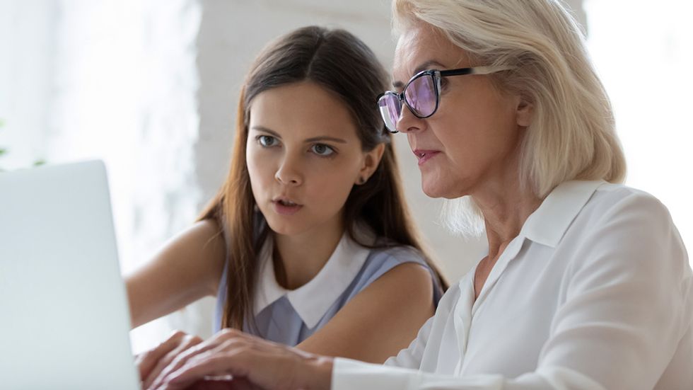 Two women mentoring each other at work