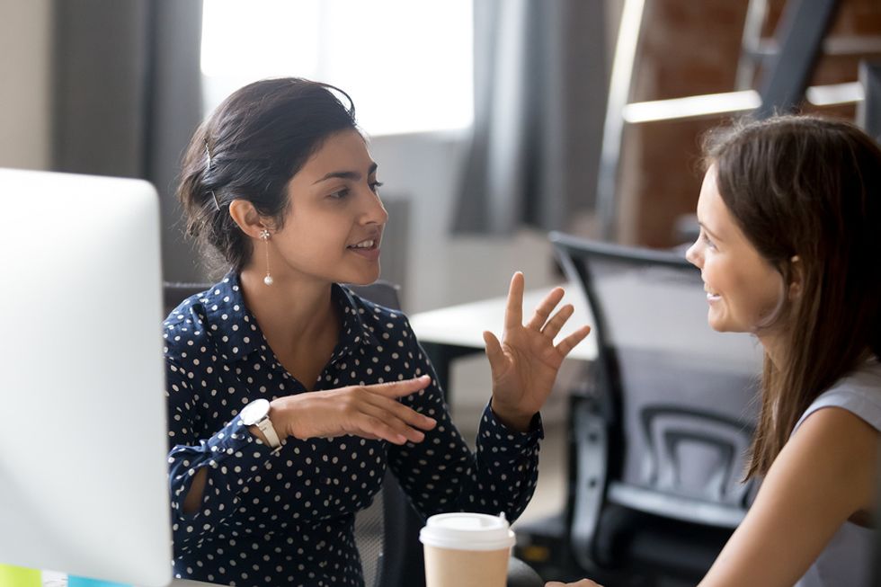 Two young professionals talk about their careers.