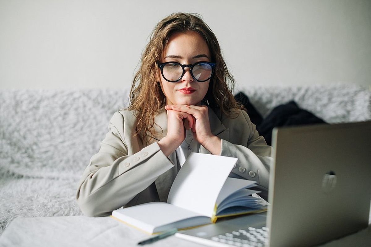 Unemployed professional woman on laptop looks for a job