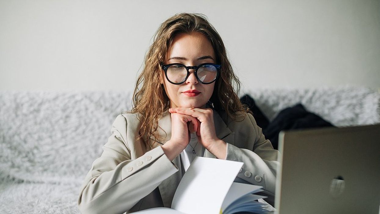 Unemployed professional woman on laptop looks for a job