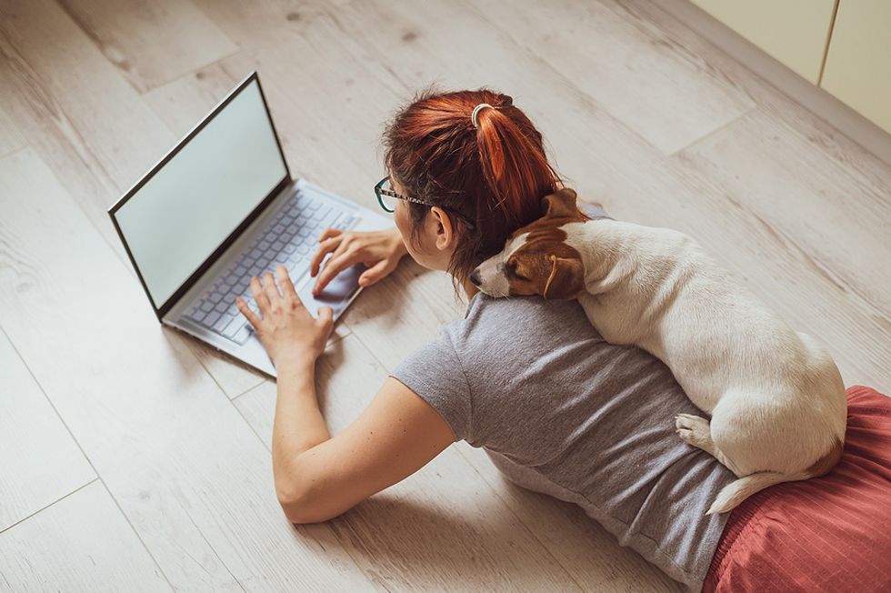 Unemployed woman on laptop writes her LinkedIn summary