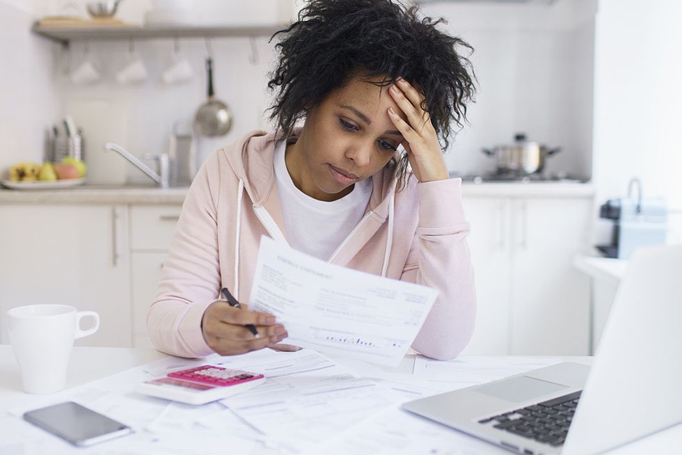 Unemployed woman stressed about bills