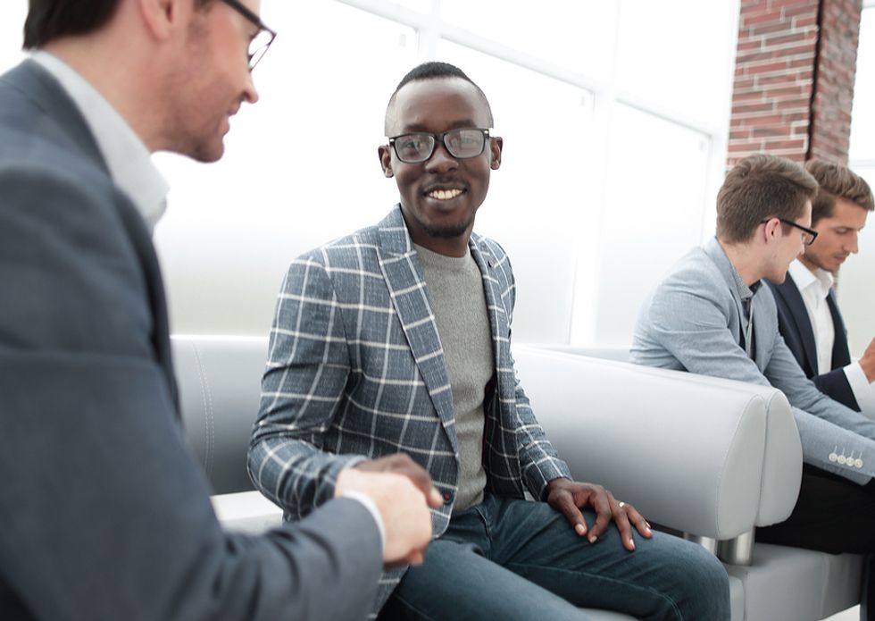 Well-dressed man interviews for a job during the holidays