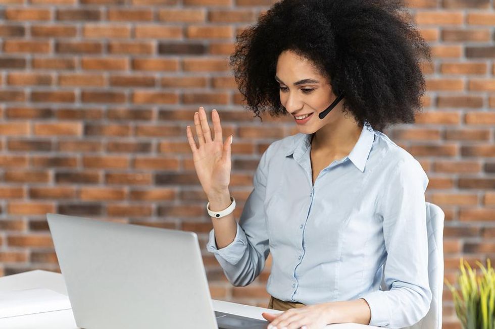 https://www.workitdaily.com/media-library/well-dressed-woman-on-a-zoom-meeting.jpg?id=25872683&width=980