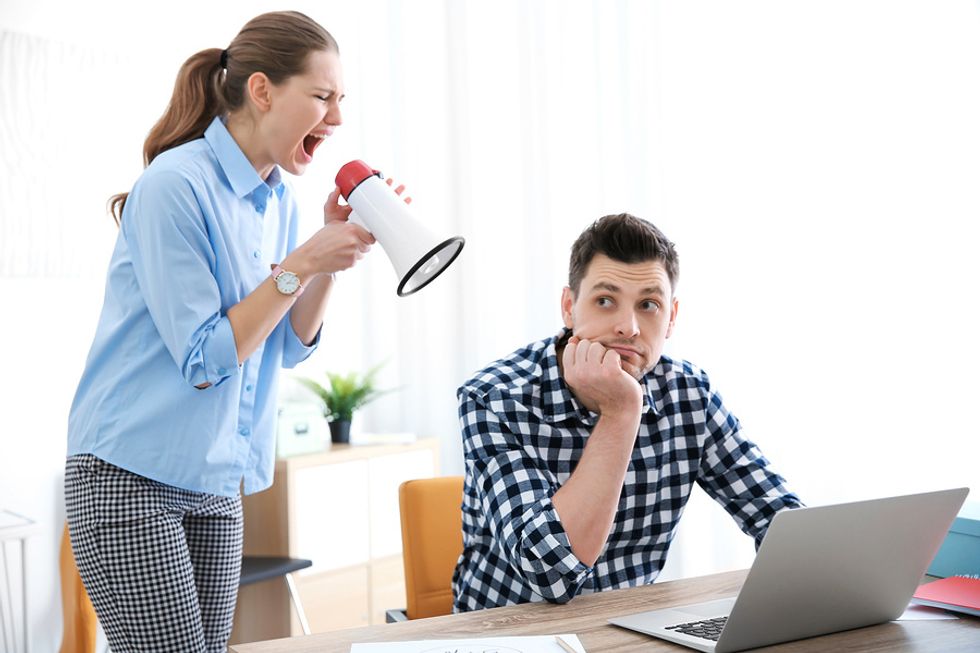 Woman annoying her co-worker