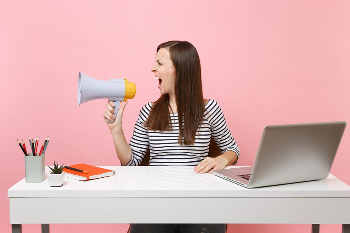 Woman annoying her co-workers in the office