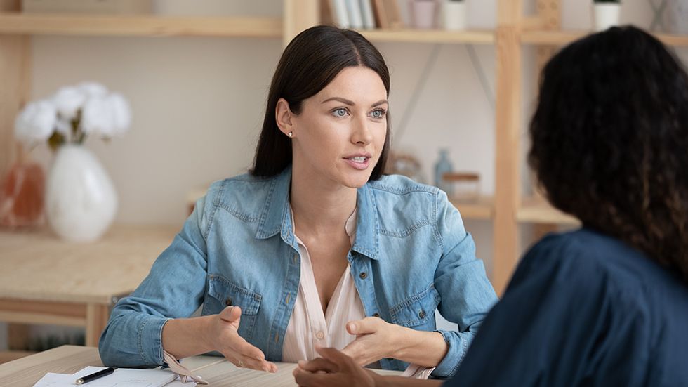 Woman answers an interview question during her holiday job search