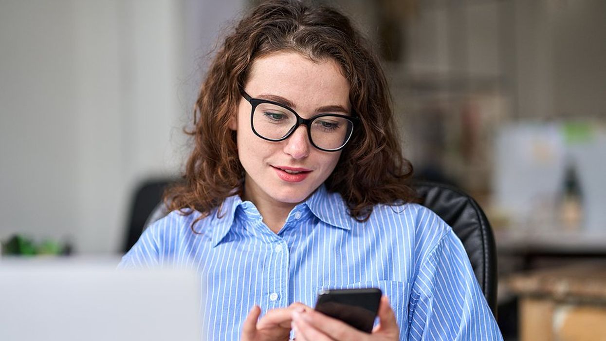 Woman answers the phone for a phone screen/interview