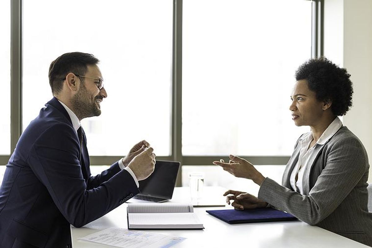 Woman asks a question during a job interview