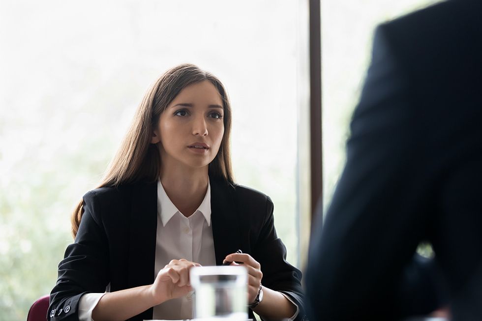 Woman asks about next steps at the end of her job interview