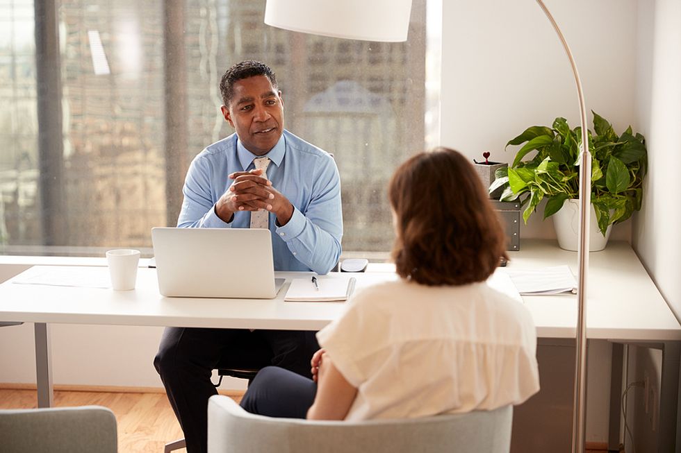 Woman asks her boss for a promotion