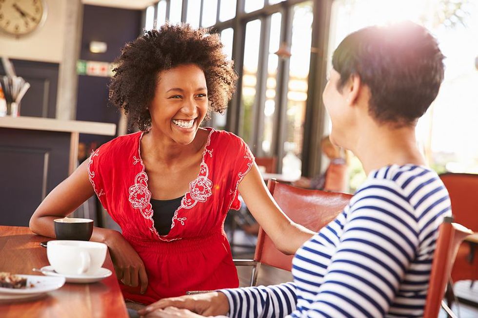 Woman avoids talking about being unemployed on a coffee date