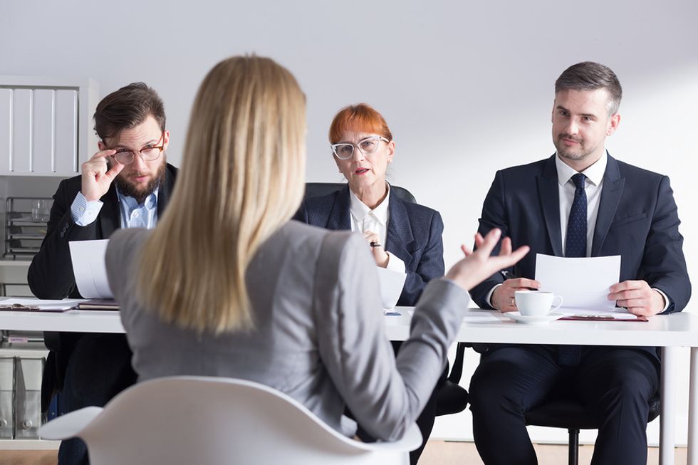 A woman badmouths her current employer during a job interview