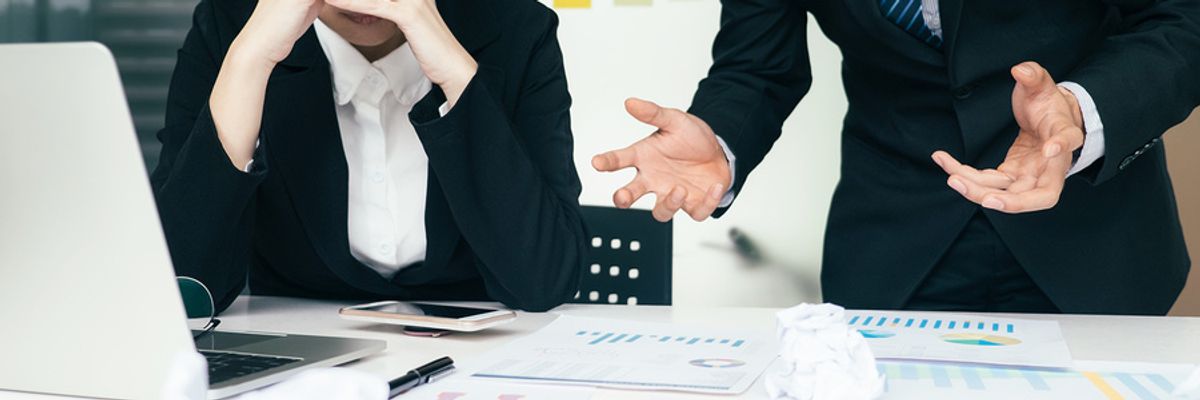 Woman being harassed by a colleague at work