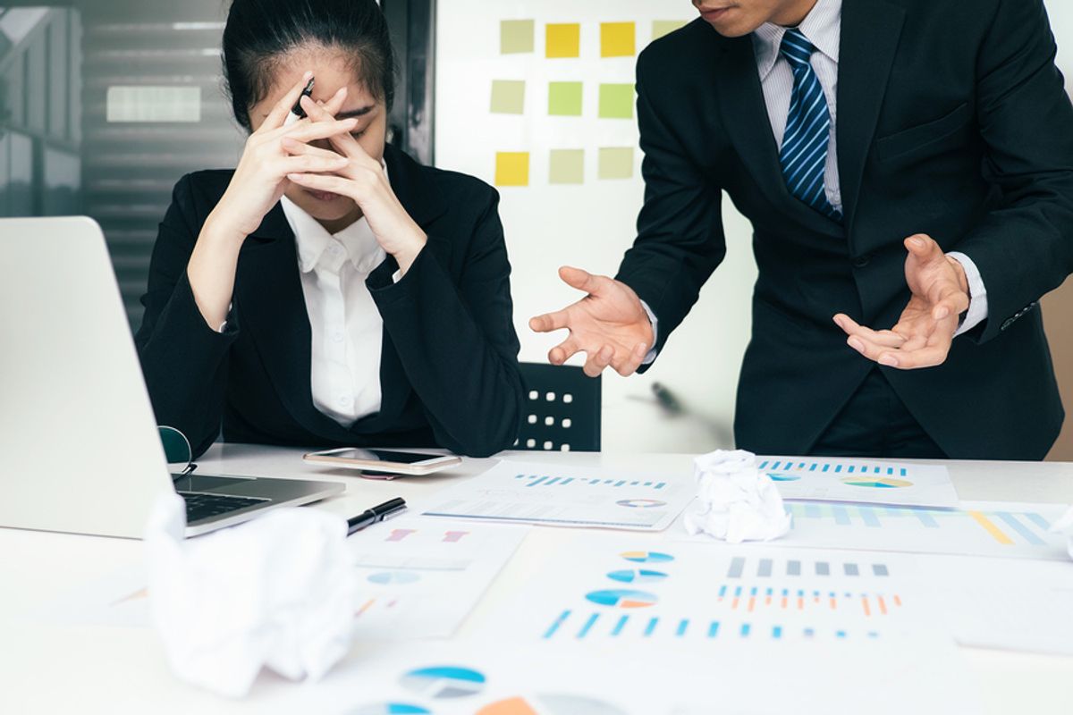 Woman being harassed by a colleague at work