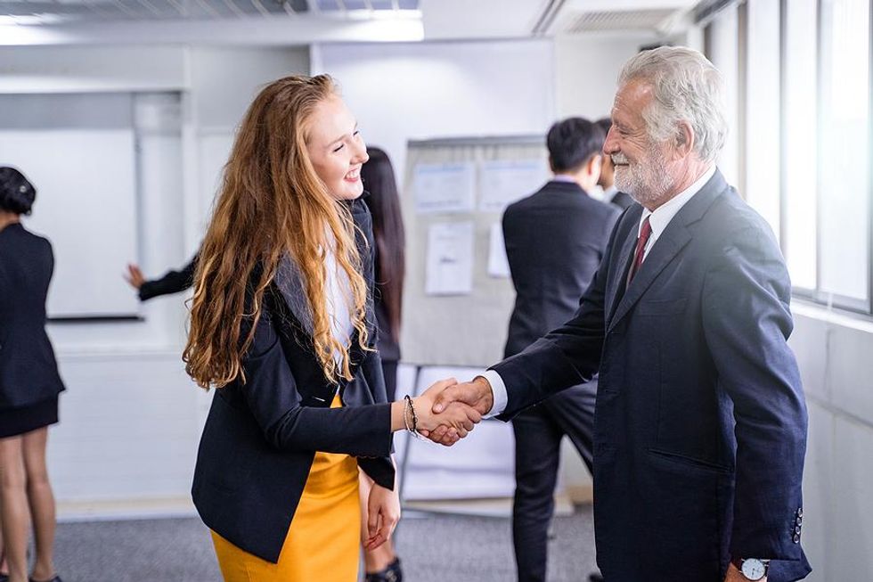 Woman builds professional network at a business networking event