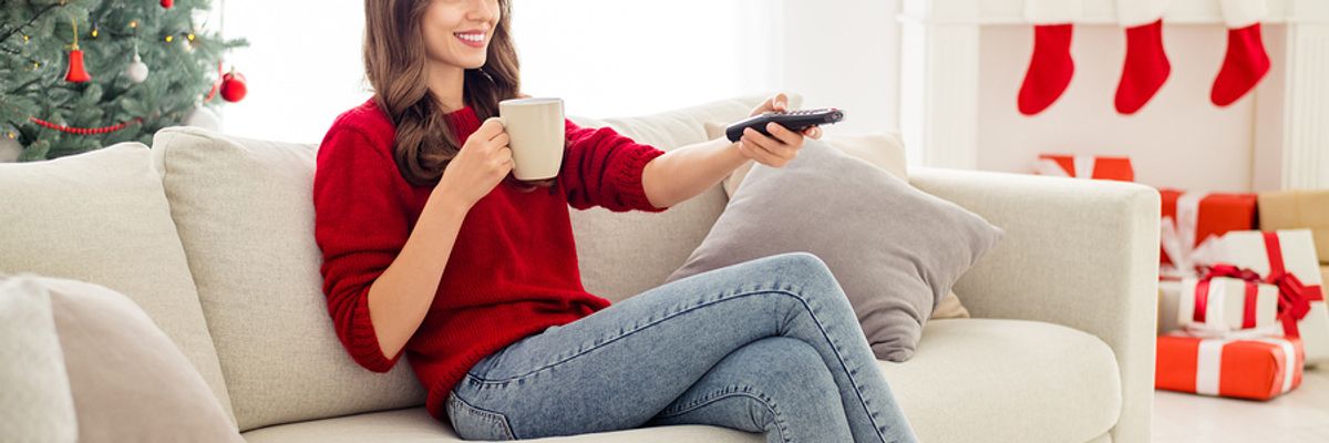 Woman catching up on movie and TV shows over the holiday break