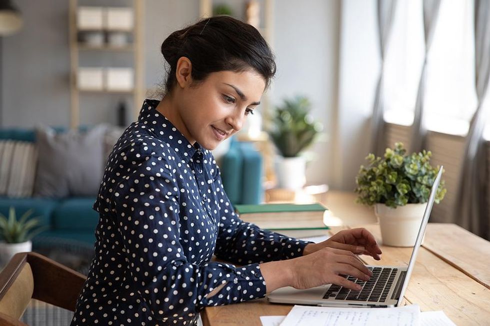 Woman checks her resume for mistakes