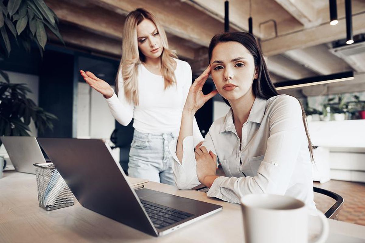 Woman dealing with a bad boss at work