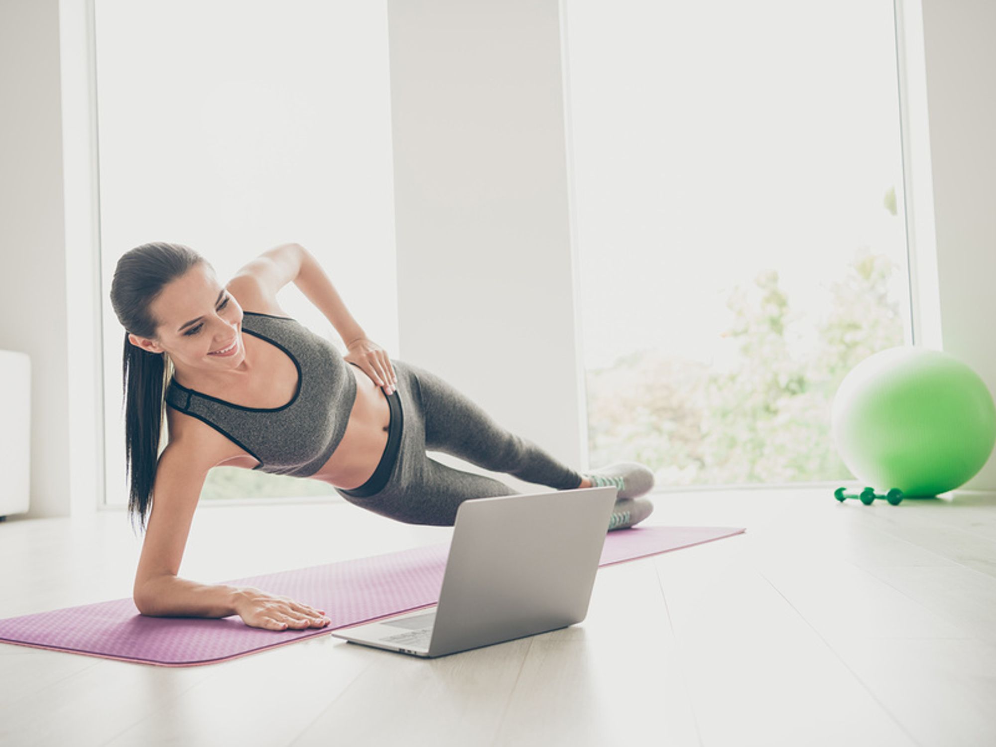 Woman does a total-body EMOM workout