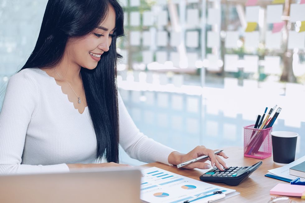Woman does her taxes for her digital business