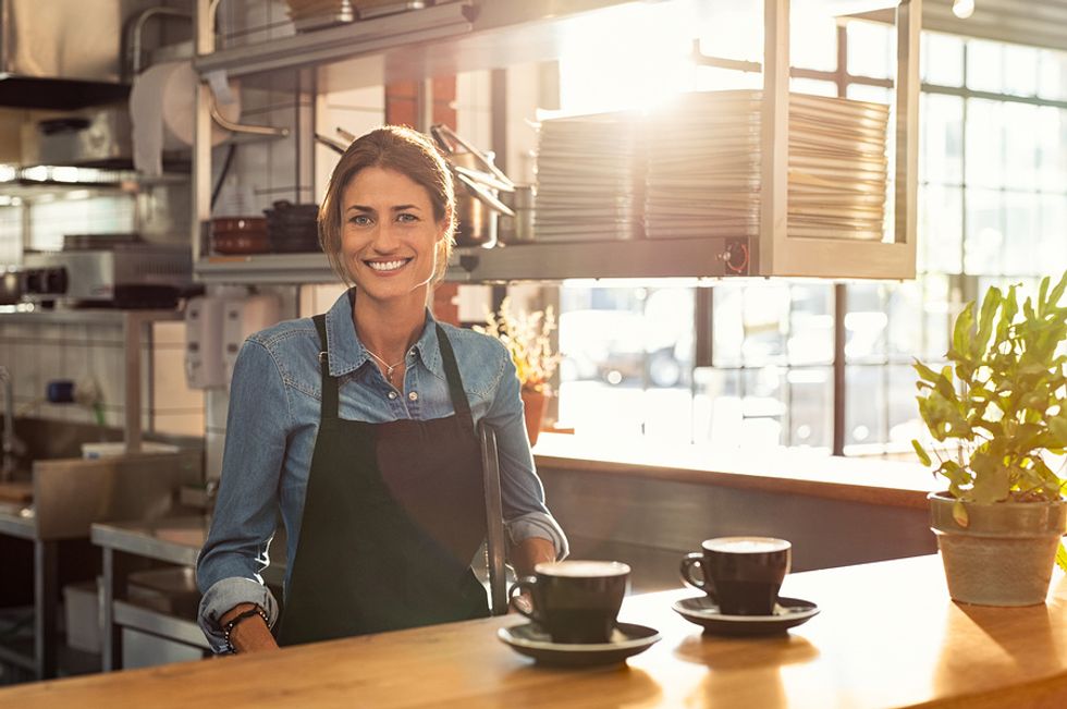 Woman entrepreneur working at her own restaurant